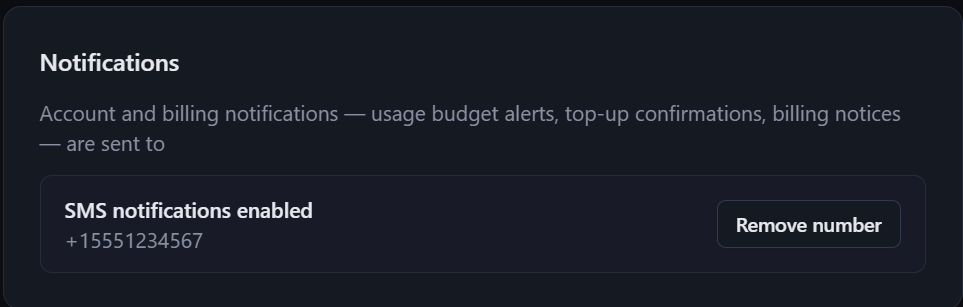 Confirmation state showing SMS notifications enabled for the saved number, with a Remove number button.